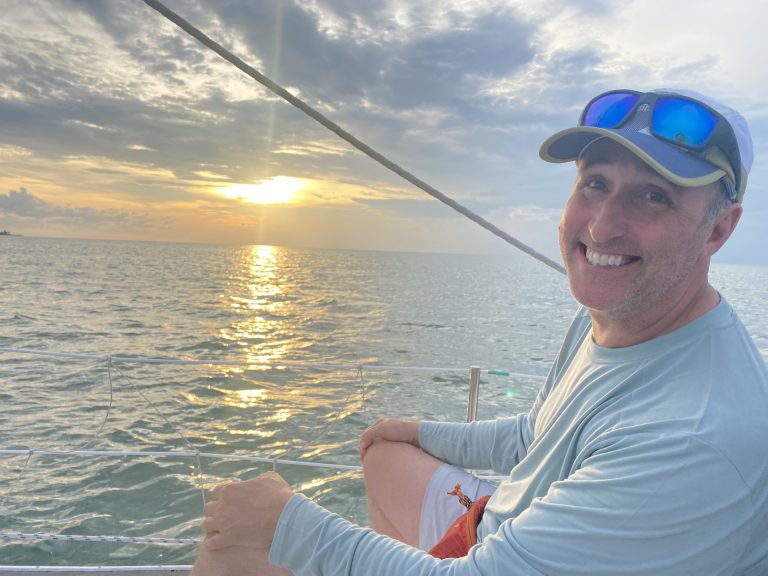 Picture of Nate on a sailboat during a Boy Scouts trip in 2022